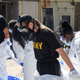 Members of Task Force 31, a U.S. military group that decontaminates long term care facilities, wear PPE in Huntsville, Alabama on March 6, 2020.
